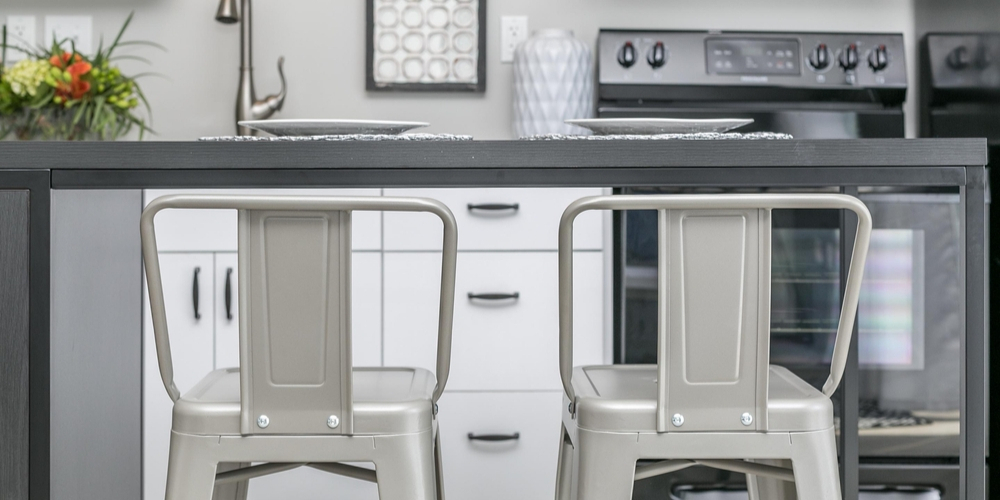 A close-up view of the modern furniture and kitchen in Boomer Town Luxury Studios