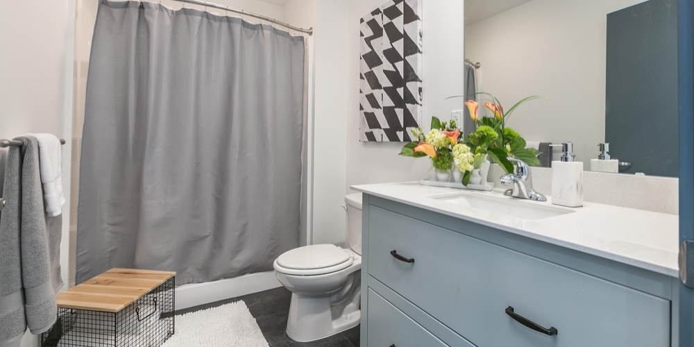 A view of a spacious, modern bathroom in Boomer Town Luxury Studios